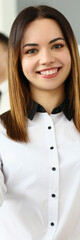 Smiling young business woman politely greets company office