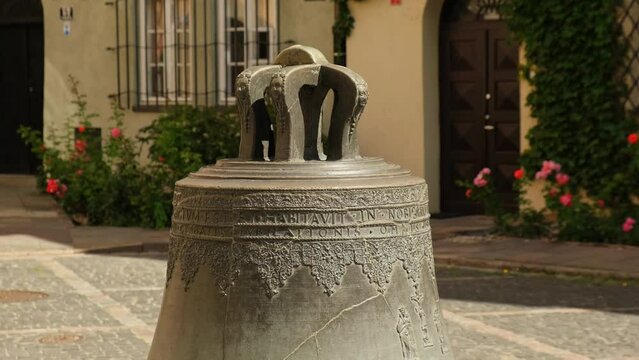 The Wishing Bronze bell in Kanonia Square in the old town of Warsaw, Poland Old town cracked bell from the cathedral now in town square. Tourist attraction travel destination