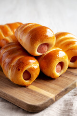 Homemade Kolache Rolls Ready to Eat on a Wooden Board, side view.