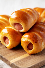 Homemade Kolache Rolls Ready to Eat on a Wooden Board, side view. Close-up.
