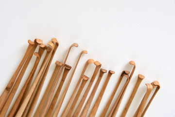Handmade bamboo ear wax removers on white background.