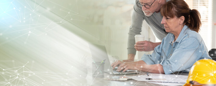 Architects working on new construction project; panoramic banner