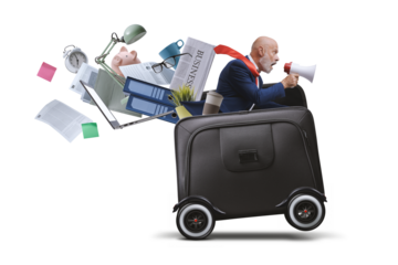 Businessman with megaphone riding a briefcase with wheels