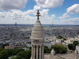 View over Paris rooftops with one of the Sacre-Coeur Basilica towers, Tour Montparnasse, Eiffel...
