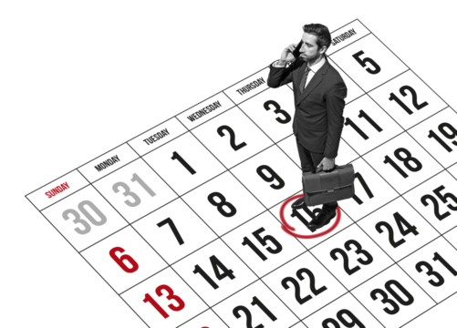 Businessman scheduling appointments on the phone
