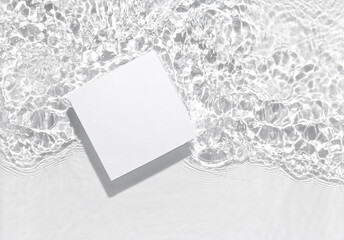 White square podium on the water surface background. Flat lay, copy space.	