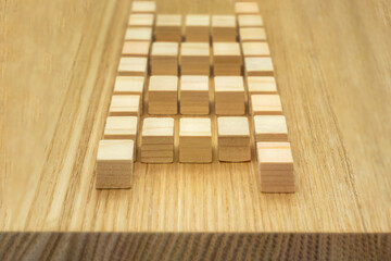 ウッドキューブのはしごが奥まで続いている木目背景
