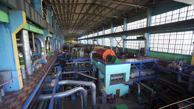 Inside a huge thermal power station, view of pipes and turbines, energy conversion system, environmental issues, power generation system, engineering structure, chp.