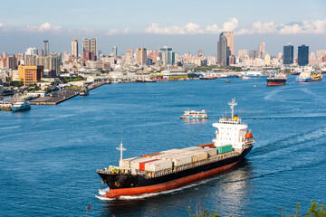 The container ship is leaving the Port of Kaohsiung, Taiwan.