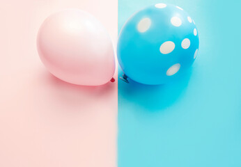 Pink and blue balloons, boy or girl gender party concept, copy space 
