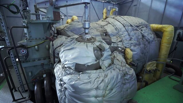 Inside a thermal power station, view of pipes and turbines, energy conversion system, environmental issues, power generation system, electrical insulation.