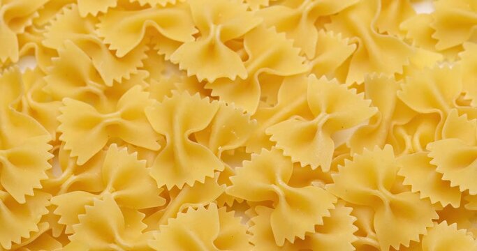 pasta backgroud - macro view of Dry Authentic Italian farfalle