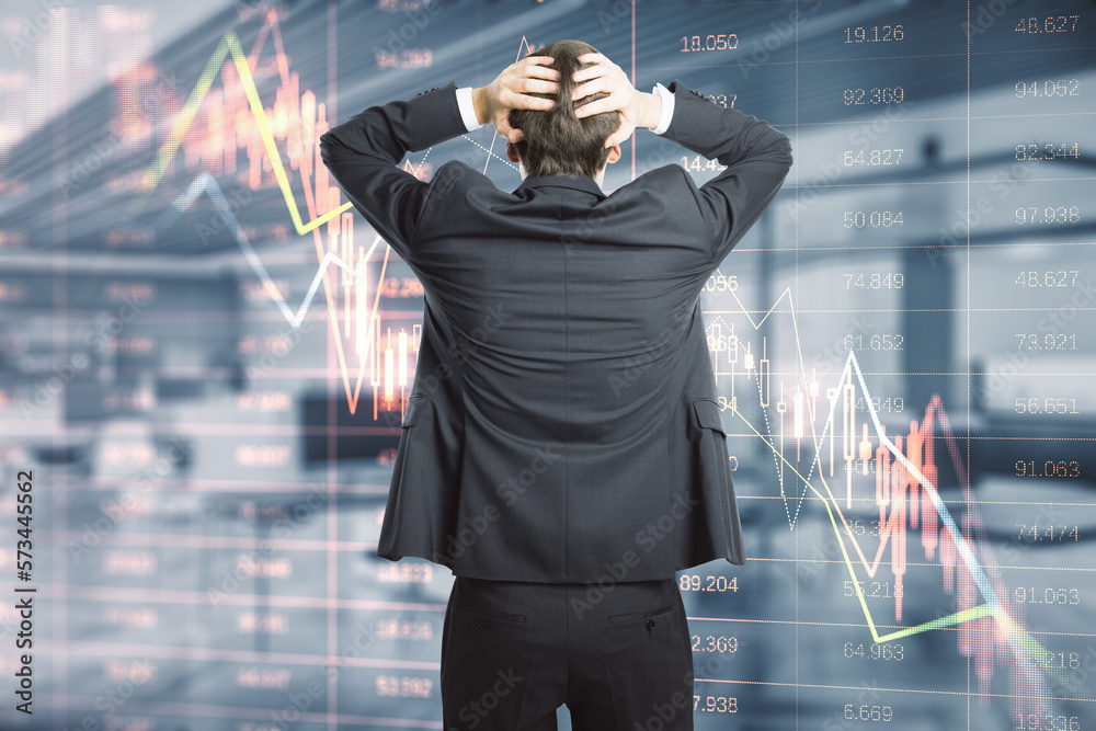 Poster Crisis and financial downturn concept with confused trader back view looking at falling down digital financial chart candlestick and diagram with stock market data indicators on virtual wall screen