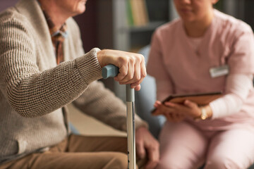 Elderly man talking to social worker