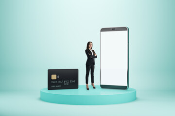 Mobile bank and online payment concept with successful woman among modern smartphone with blank...