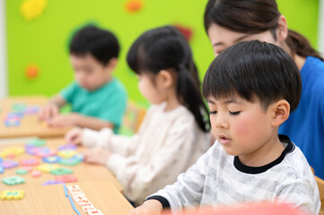Fototapeta premium Children in daycare centers, nurseries, kindergartens, etc. Study English