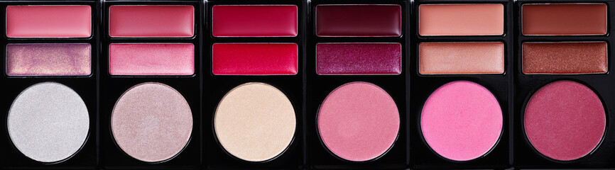 Multi-colored eye shadow palette top view. Abstract background of eye shadows.