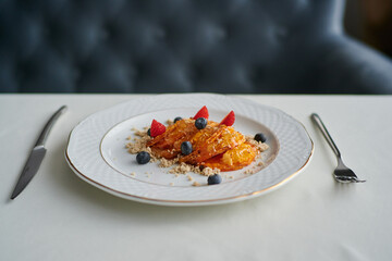 stewed pear with blueberries, strawberries and sprinkles