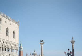 Fototapeta na wymiar Background with landmarks elements of St. Mark's Square and blue sky with copy space