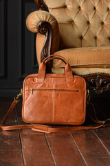 close-up photo of orange leather bag corporate.