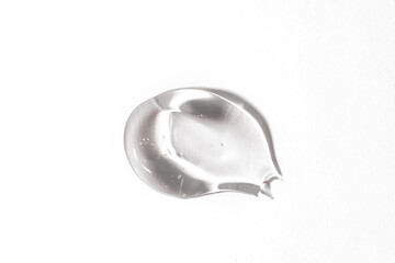 Cosmetic lotion transparent gel drop texture on blue background,
