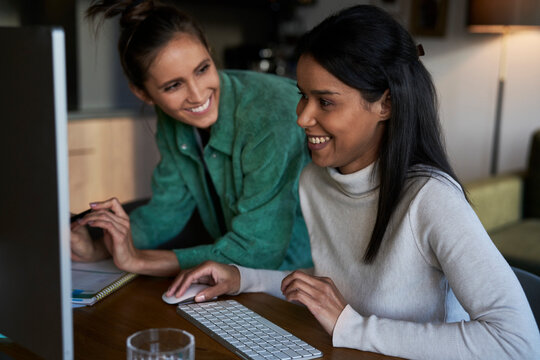 Happy freelancers working together at home office
