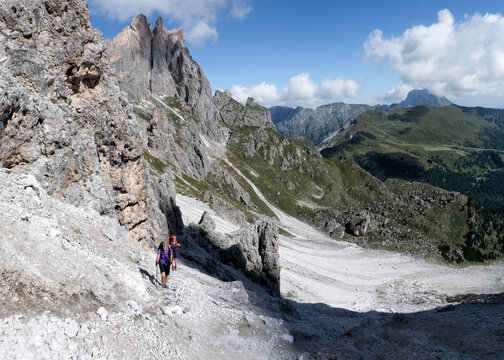 Senior woman hiking at Forcella Della Roa, Dolomites, Italy
