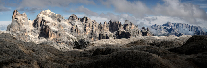 Rocky mountains under cloudy sky at Dolomites, Italy