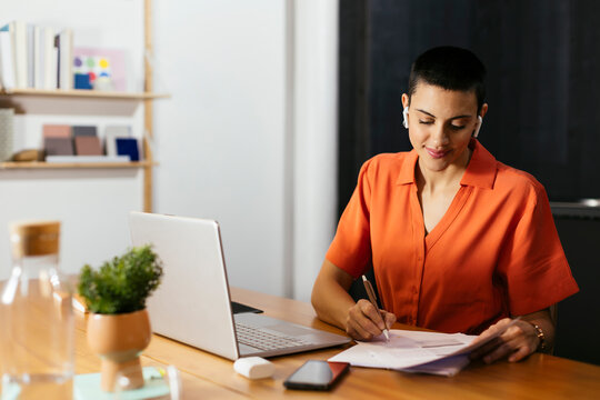 Freelancer working on document at table