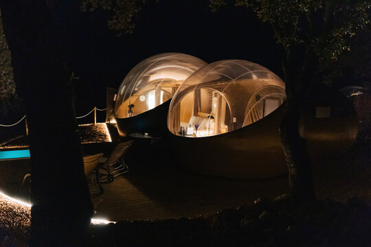 Illuminated dome tents at night