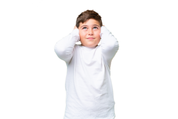 Little caucasian kid over isolated chroma key background frustrated and covering ears