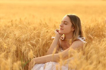 Fototapeta na wymiar Woman relaxing alone in a field