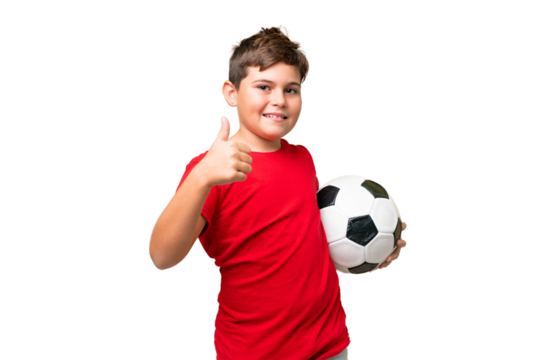 Little caucasian kid over isolated chroma key background with soccer ball and with thumb up