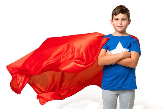 Little caucasian kid over isolated chroma key background in superhero costume with arms crossed