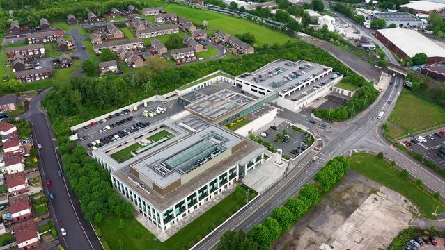 Aerial drone footage of the Police headquarters the city of Leeds west Yorkshire in the UK, showing the new Police building from above in the summer time on a hot sunny day