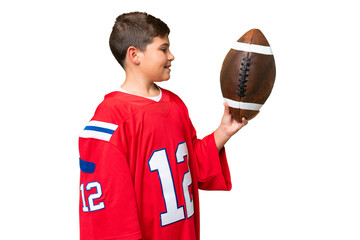 Little caucasian kid playing rugby over isolated chroma key background with happy expression