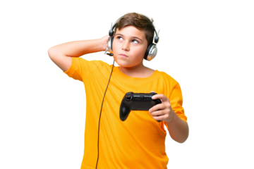 Little caucasian kid playing with a video game controller over isolated chroma key background having doubts