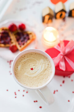Coffee with breakfast and heart shaped gift box