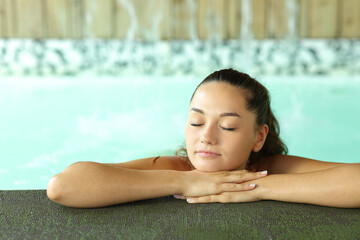 Woman resting in a spa pool