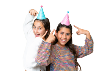 Friends girls in a birthday over isolated chroma key background