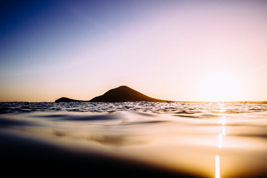 An isthmus shot from the water at sunset