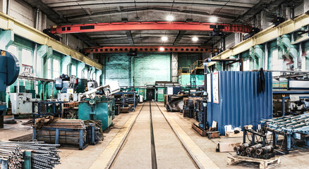 Interior of metalworking factory workshop hangar. Modern industrial enterprise production.