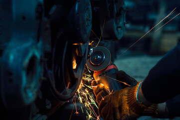 long exposure photo car repair, installation of rear disc brakes instead of drums, welding,...