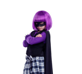 A cute little confident kid girl in a supergirl or a superwoman avatar standing with her hands crossed and staring at th camera isolated on a png background.