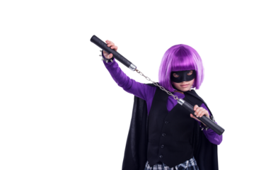 A little girl in a Halloween contest character dressed up in character with nunchucks for fighting. A kid girl with martial art karate weapons and a purple hair wig isolated on a png background.