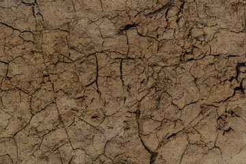 dry land in the dry season Drought, ground cracks, no hot water. Lack of humidity effect from global cracked soil in drought abstract nature background with cracked soil