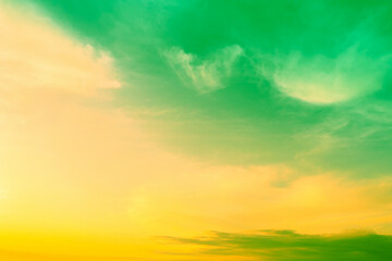 Beautiful green yellow cloudy sky at sunset. Sky texture, abstract nature background