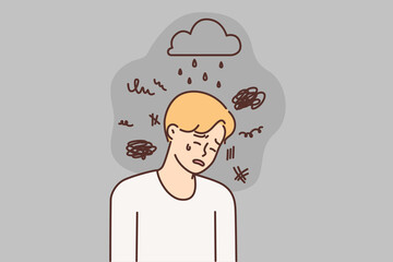 Depressed man crying due to bad weather and stress needs support psychotherapist