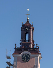 Tower and spire of the church Stora Kyrkan in the old own Gamla Stan a winter day in Stockholm