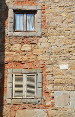 Fototapeta na wymiar Italian window in an old stone house